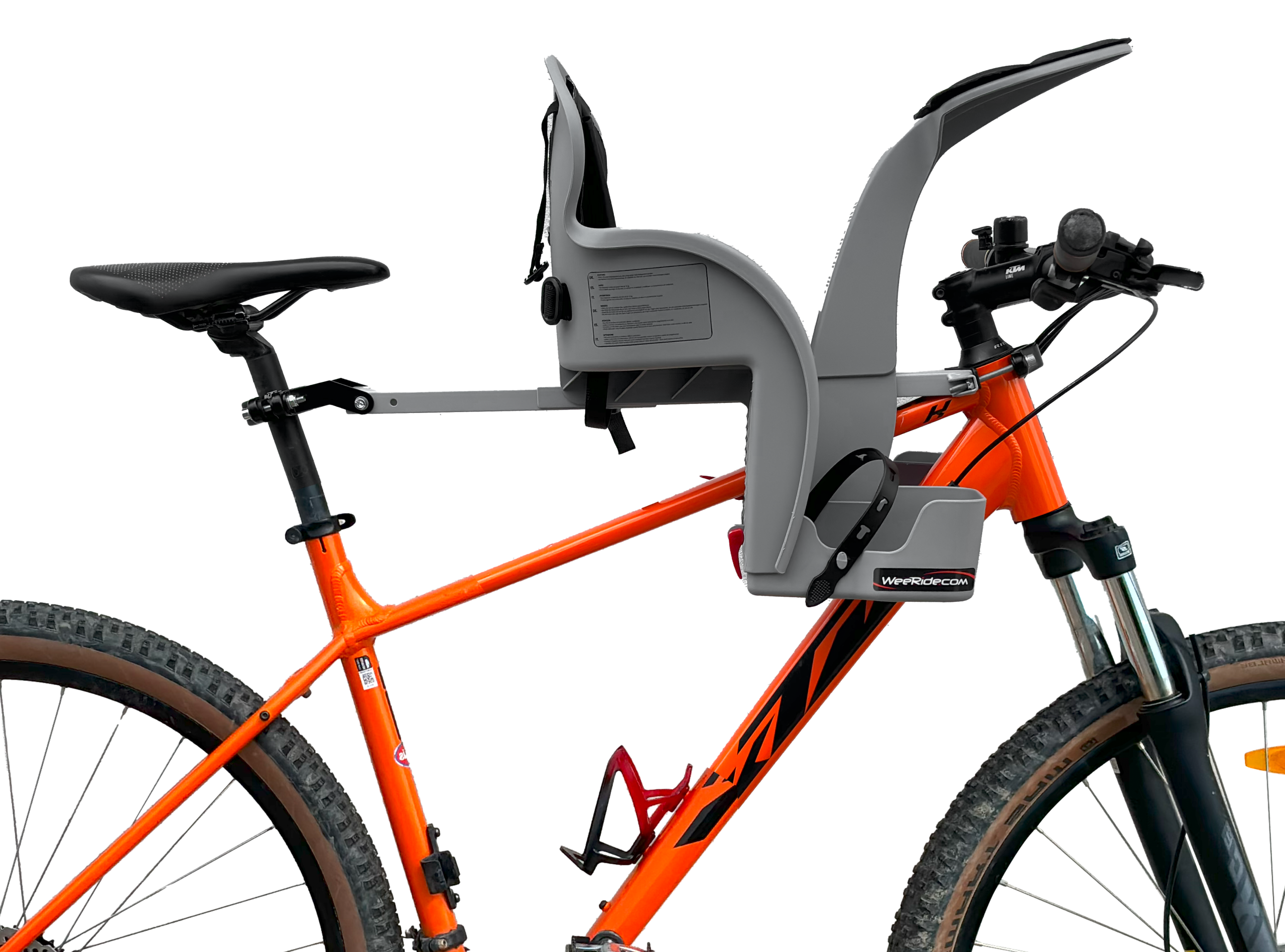 WeeRide Safe Front centre-mounted child bike seat installed on an orange KTM bike, showing the crossbar mounting system