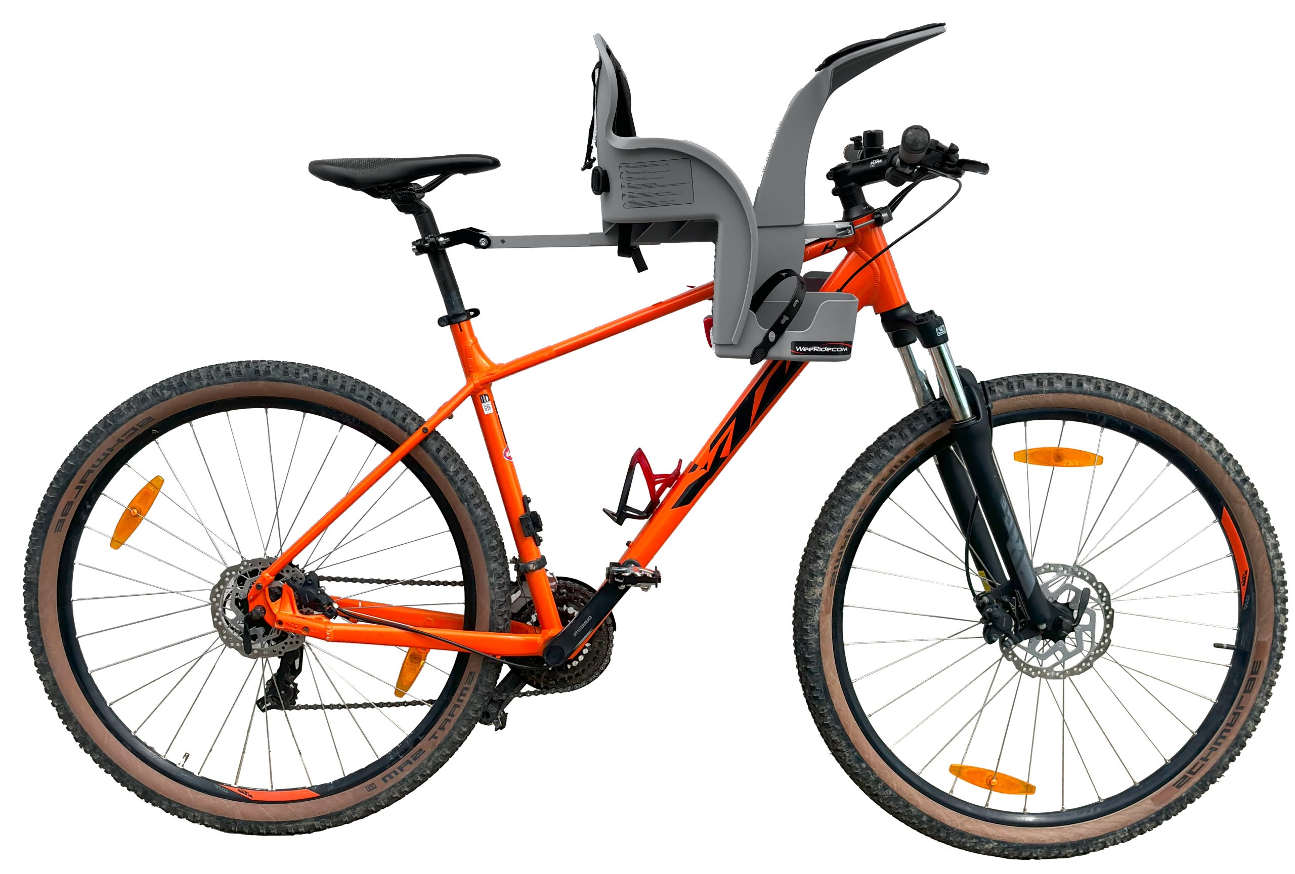 WeeRide Safe Front centre-mounted child bike seat installed on a bike, showing the crossbar mounting system